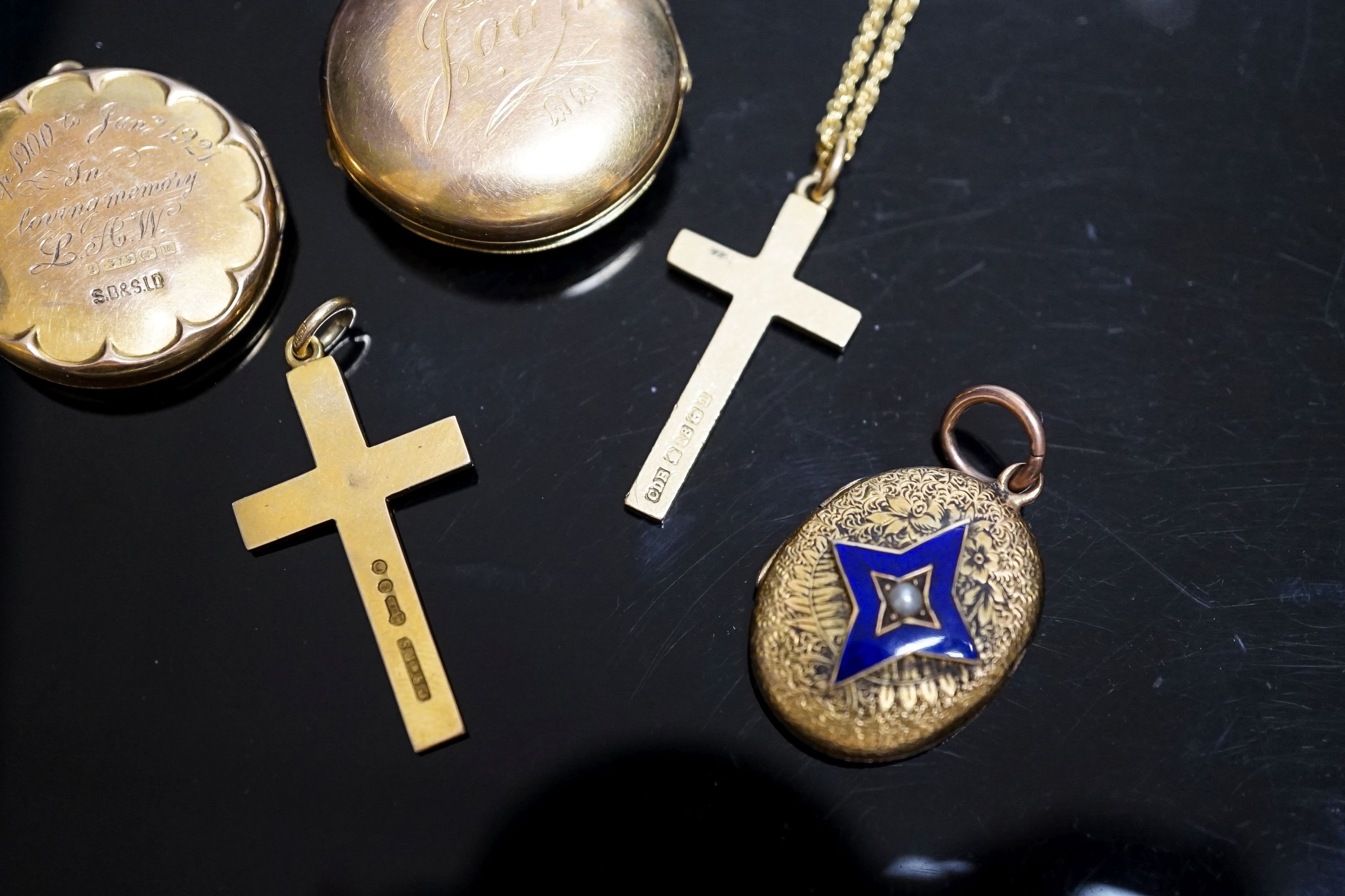 A group of small lockets and an 18ct cross pendant, 3.2 grams and a 15ct cross pendant, 3.6 grams.